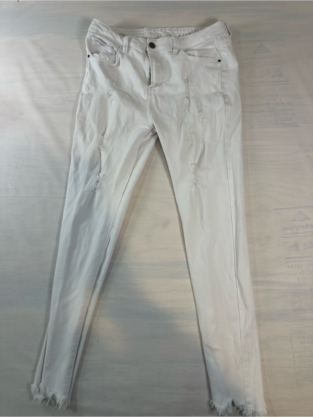 Roswear Women’s  White Skinny Jeans with Subtle Distressing